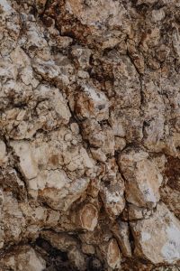 Kaboompics - Pale Weathered Rock with Brown Mineral Lines and Fissures
