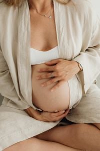 Kaboompics - Close-Up Pregnant Belly in a White Robe