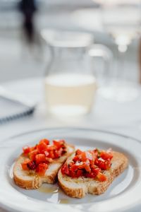 Kaboompics - Dreamy Shallow Focus Bruschetta with Wine Glass