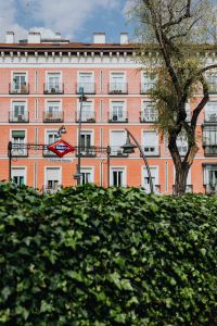 Kaboompics - Tirso de Molina Metro Station and Pink Apartment Facade in Madrid