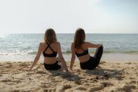 Kaboompics - Two Women Stretching on the Beach