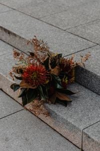 Kaboompics - Autumn Flower Bouquet Lying on Stone City Steps