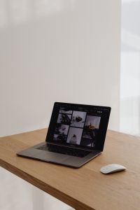 Kaboompics - Laptop And Mouse On Wooden Desk With Window Light