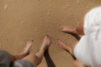 Kaboompics - Friends Standing Barefoot on the Beach
