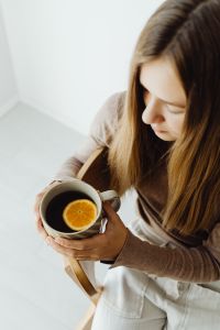 Kaboompics - Top View of Woman Holding a Cup of Tea