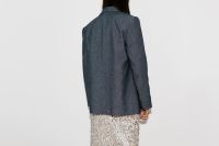 Kaboompics - Flash Photography Portrait of Woman in Blue Shirt and Patterned Skirt from Behind