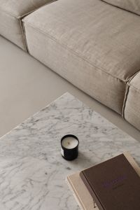 Kaboompics - Close Beige Sofa Cushion with Marble Table and Candle