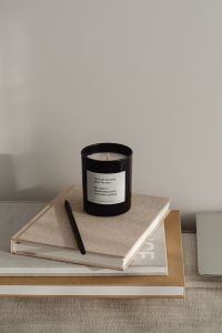 Kaboompics - Minimal Home Office Copy Space with Black Candle and Planner Books