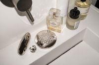 Kaboompics - Overhead UGC-Style Skincare and Compact on Sink Ledge