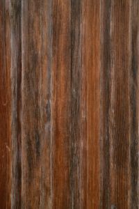 Kaboompics - Weathered Vertical Wood Planks with Faded Red and Grey Tones