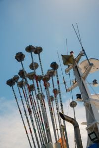 Kaboompics - Fishing Boat Marker Poles Against Blue Sky