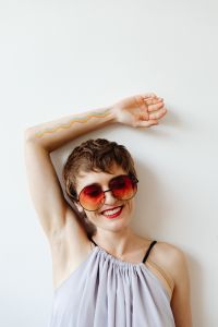Kaboompics - Smiling Short-Haired Woman with Rainbow Pride Body Art