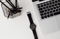 Kaboompics - Black Watch Flat Lay Beside MacBook and Desk Organizer