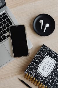 Kaboompics - Wide Top View of Laptop, Smartphone, AirPods and Notes Notebook