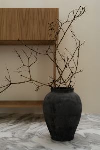 Kaboompics - Wabi Sabi Decor with Branches and Dark Ceramic Vase