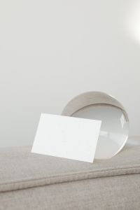 Kaboompics - Landscape Business Card Mockup with a Glass Sphere on Linen