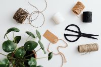 Kaboompics - Rustic Gift Wrapping Materials With Jute String And Houseplant