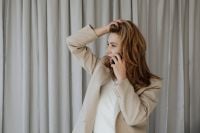 Kaboompics - Businesswoman on the Phone Adjusting Her Hair