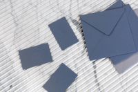 Kaboompics - Blue Business Card Mockup with Matching Envelopes on White Ribbed Marble