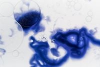 Kaboompics - Blue Liquid With Circular Bubble And Ink Swirl