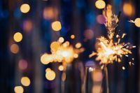 Kaboompics - Champagne Glass with Sparkler Light and Soft Blue Party Bokeh