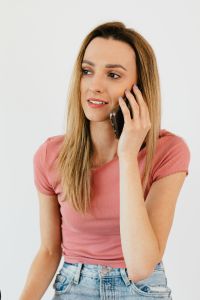 Kaboompics - Close-Up Portrait of a Woman on a Phone Call, Home Office Communication and Lifestyle Content
