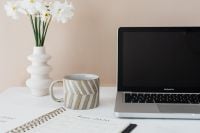 Kaboompics - Home Office Planner, Coffee and White Flowers beside Laptop