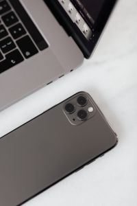 Kaboompics - MacBook Pro 15 laptop and iPhone 11 Pro on a marble table