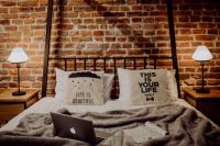 Kaboompics - Enjoying evening with a Macbook in a nice bed