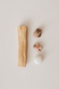 Kaboompics - Palo Santo Stick and Three Stones on a Neutral Energy Cleansing Background