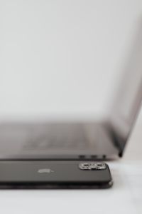 Kaboompics - MacBook Pro 15 laptop and iPhone 11 Pro on a marble table