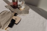 Kaboompics - Chanel No. 5 Perfume and Dom Rosa Bottle on Stone Slab