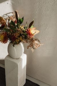 Kaboompics - White Textured Wall with Floral Arrangement and Window Shadows