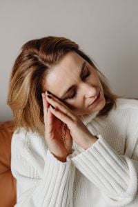 Kaboompics - Woman Resting with a Cross Necklace and Eyes Closed