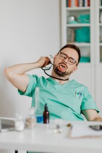Kaboompics - Doctor Holding Laboratory Flask in Medical Office