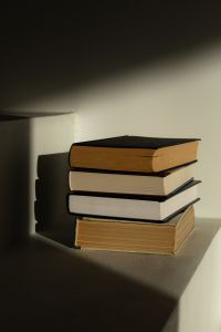 Kaboompics - Hardcover Books in Dramatic Sunlight and Shadow