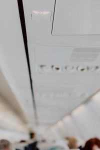 Kaboompics - Cabin inside the aircraft, lights, air condition and signs panel above the seat