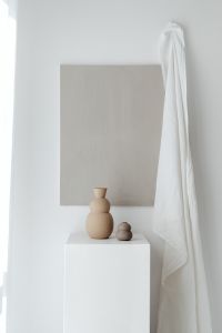 Kaboompics - Small Beige Sculptural Pottery on a White Plinth
