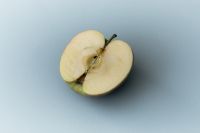Kaboompics - Sliced Apple on Blue Background