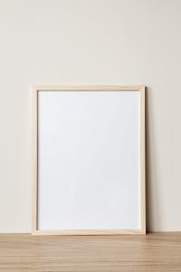 Kaboompics - Large Empty Frame Mockup on Neutral Wall for Landscape Art and Poster Design