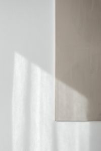 Kaboompics - Empty White and Greige Wall with Diagonal Sunlight