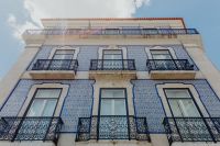 Kaboompics - Upward View of Blue Azulejo-Tiled Lisbon Facade with Iron Balconies