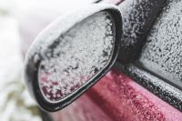 Kaboompics - Frost on a red car