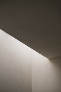 Kaboompics - Minimalist White Wall Corner with Dramatic Ceiling Shadow – Fujifilm X100VI