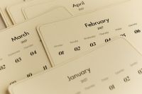 Kaboompics - Layered 2027 Calendar Pages Showing Winter and Spring Months