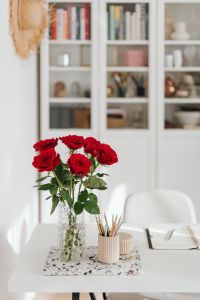 Kaboompics - Red Rose Vase and Pencil Holder Beside Open Planner in Bright Home Office
