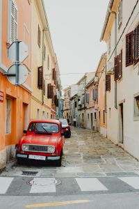 Kaboompics - An old red Renault 4 car parked on the street in Izola, Slovenia