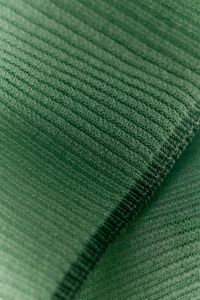 Kaboompics - Sage green ribbed knit fabric folded texture background
