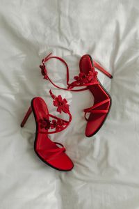 Kaboompics - Red Floral Strappy Heels on White Bedding