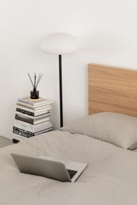 Kaboompics - Laptop on a Minimalist Gray Bed